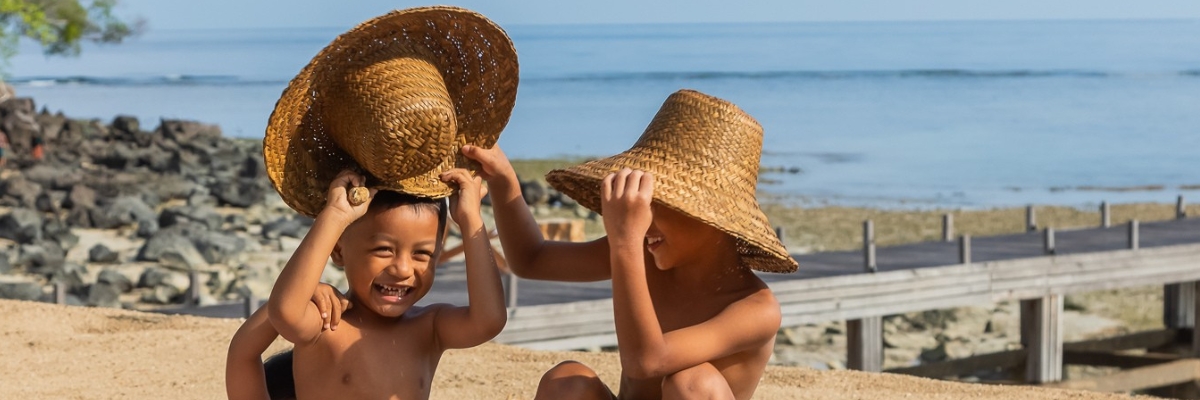 lombok, an island with a heart - Three young Lombok locals having fun on the beach